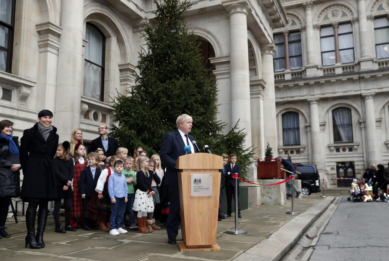 Boris Johnson speaks during the unveiling of the Christmas tree (Adrian Dennis/PA)