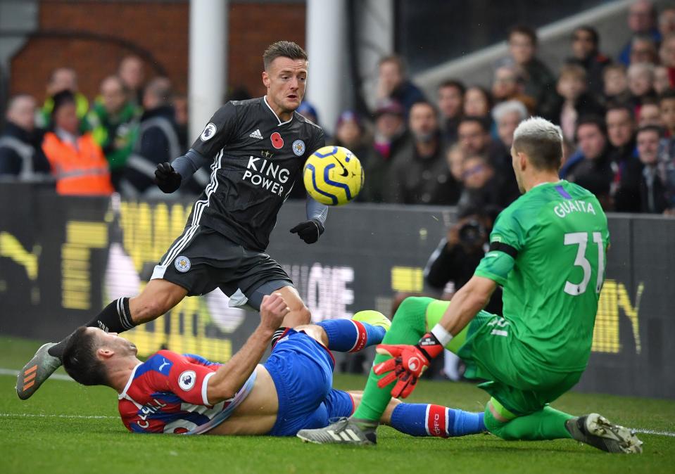 Leicester City's English striker Jamie Vardy (C) vies with Crystal Palace's English defender Gary Cahill (L) and Crystal Palace's Spanish goalkeeper Vicente Guaita during the English Premier League football match between Crystal Palace and Leicester City at Selhurst Park in south London on November 3, 2019. (Photo by Ben STANSALL / AFP) / RESTRICTED TO EDITORIAL USE. No use with unauthorized audio, video, data, fixture lists, club/league logos or 'live' services. Online in-match use limited to 120 images. An additional 40 images may be used in extra time. No video emulation. Social media in-match use limited to 120 images. An additional 40 images may be used in extra time. No use in betting publications, games or single club/league/player publications. /  (Photo by BEN STANSALL/AFP via Getty Images)