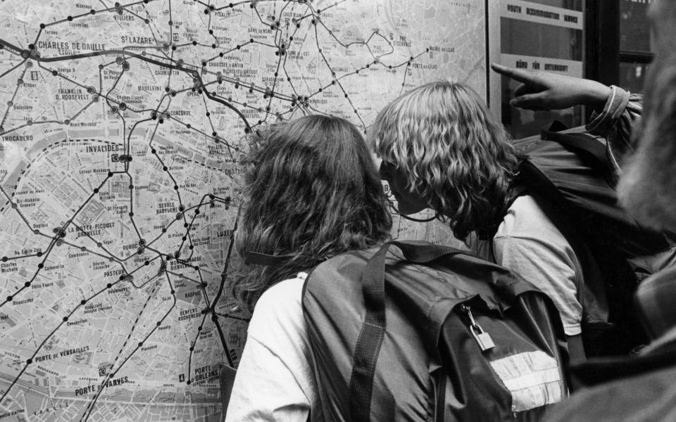 Tourist navigating the Paris Metro - Getty