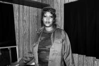 <p>The Queen of Soul dresses casually backstage during ChicagoFest in 1981. The early '80s were a rocky time for the successful soul singer, who <a href="https://www.rollingstone.com/music/music-features/arethas-greatest-albums-love-all-the-hurt-away-1981-712308/" rel="nofollow noopener" target="_blank" data-ylk="slk:left Atlantic Records in 1980;elm:context_link;itc:0;sec:content-canvas" class="link ">left Atlantic Records in 1980</a> to join Clive Davis's label, Arista Records. </p>