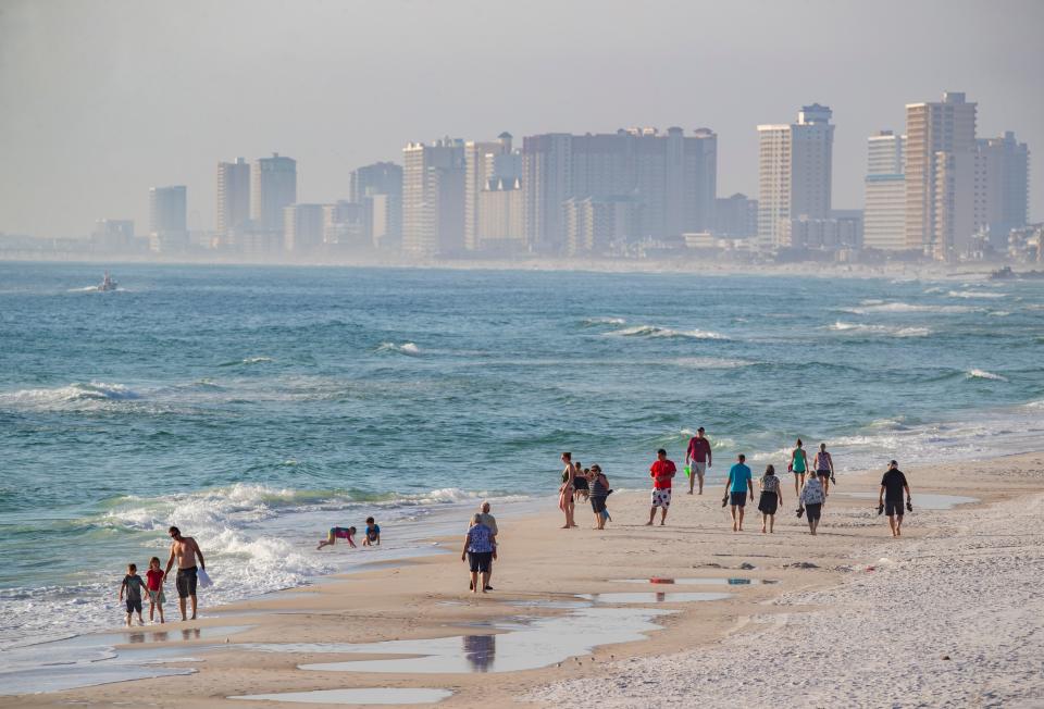 The beaches along Panama City Beach will be packed during Spring Break. This view looking west from the pier at St. Andrews State Park shows condos and hotels looming over beach walkers in February.