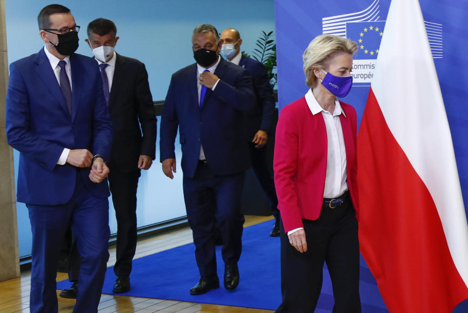 From left, Poland's Prime Minister Mateusz Morawiecki, Czech Republic's Prime Minister Andrej Babis and Hungary's Prime Minister Viktor Orban follow behind European Commission President Ursula von der Leyen prior to a meeting at EU headquarters in Brussels, Thursday, Sept 24, 2020. (Francois Lenoir, Pool via AP)