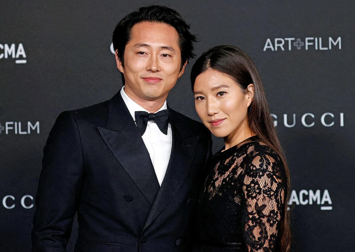 US actor Steven Yeun (L) and wife Joana Pak arrive for the 10th annual LACMA Art+Film gala at the Los Angeles County Museum of Art