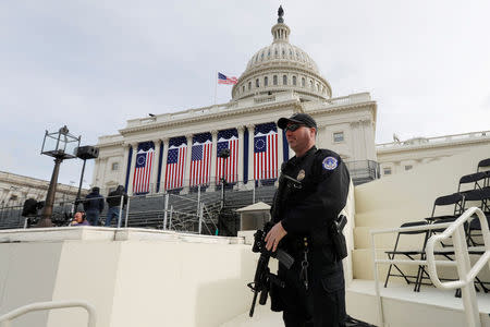 A Capitol Police officer stands guard at the U.S. Capitol before the inauguration of U.S. President Elect Donald Trump in Washington, DC, U.S., January 19, 2017. REUTERS/Brian Snyder