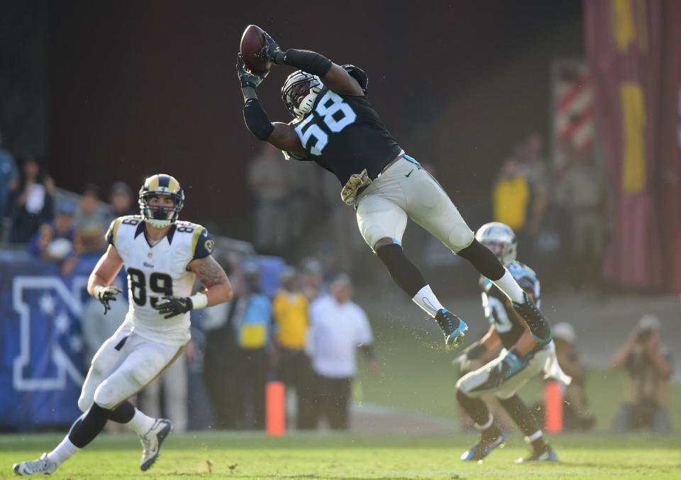 <p>Thomas Davis #58 of the Carolina Panthers catches the ball for an interception during the third quarter of the game against the Los Angeles Rams at the Los Angeles Coliseum on November 6, 2016 in Los Angeles, California. (Photo by Harry How/Getty Images) </p>