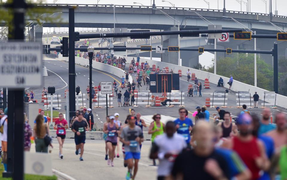 Runners make their way down the new off ramp from the Hart Bridge to Gator Bowl Blvd. on their way to the finish line of the 2022 Gate River Run.
