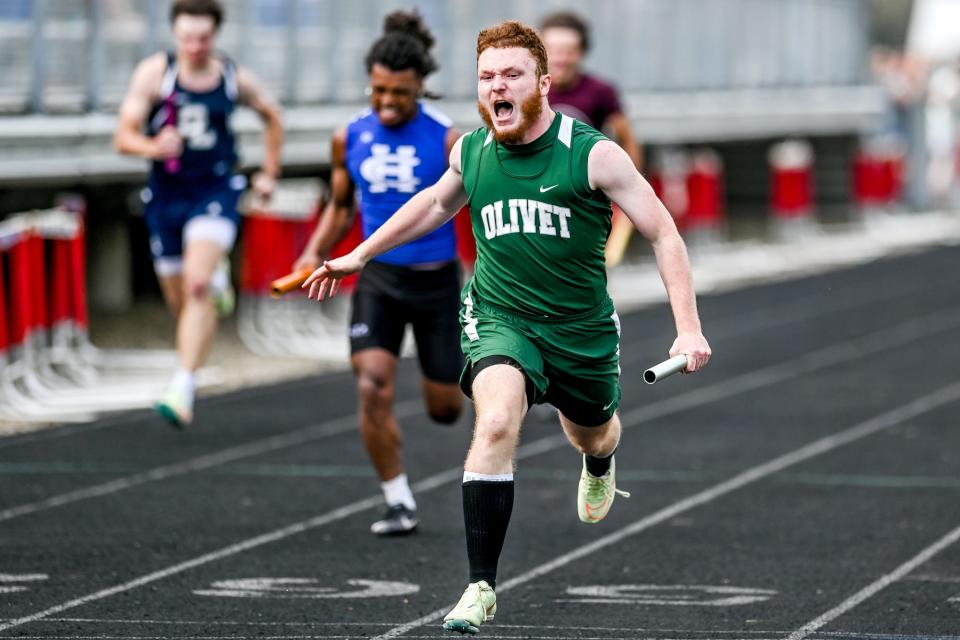 Olivet's Hitoyuki Gallimore celebrates after crossing the finish line while competing in the 4x100 meter relay during the regional track meet on Friday, May 20, 2022, at Mason High School. Olivet is leaving the GLAC to join the CAAC starting in the 2023-24 school year.