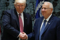 <p>US President Donald Trump (L) and Israel’s President Reuven Rivlin shake hands following a press conference at the president’s residence in Jerusalem on May 22, 2017. (Photo: Thomas Coex/AFP/Getty Images) </p>