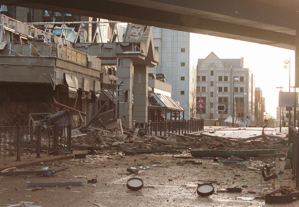 FILE - This Saturday, Feb. 10, 1996, file photo shows the destruction of a bomb blast at South Quay in London's Docklands area in which 30 people were injured. The bomb exploded near Britain's tallest high-rise, Canary Wharf Tower, just an hour after the IRA announced Friday it was aborting a one and a half year-old cease-fire. Relations between Britain and Ireland have experienced many highs and lows in a century marked by rebellion, terror and treaties. (AP Photo/Alastair Grant, File)