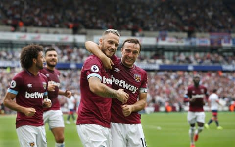 Marko Arnautovic celebrates scoring with Mark Noble - Marko Arnautovic celebrates scoring with Mark Noble - Credit: Getty Images