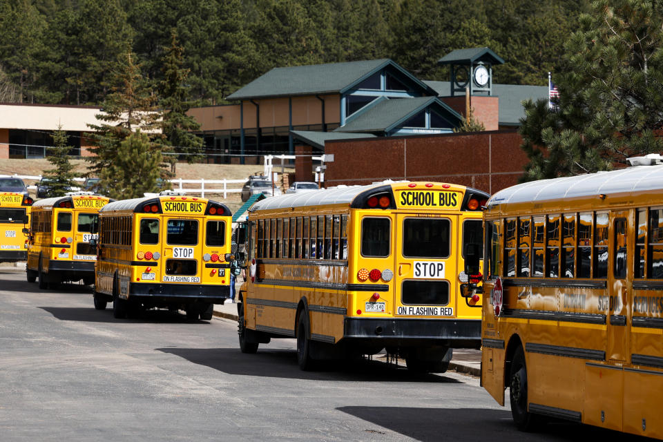 School busses arrive at Gateway Elementary School to pick up kids from school on April 12, 2023 in Woodland Park, Colo. (Michael Ciaglo for NBC)