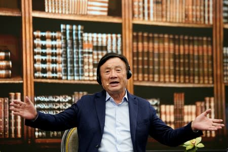 Huawei founder Ren Zhengfei attends a panel discussion at the company headquarters in Shenzhen