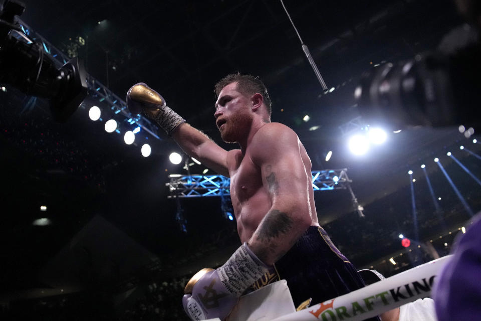 Canelo Alvarez, of Mexico, celebrates after defeating Jermell Charlo in their super middleweight title boxing match, Saturday, Sept. 30, 2023, in Las Vegas. (AP Photo/John Locher)