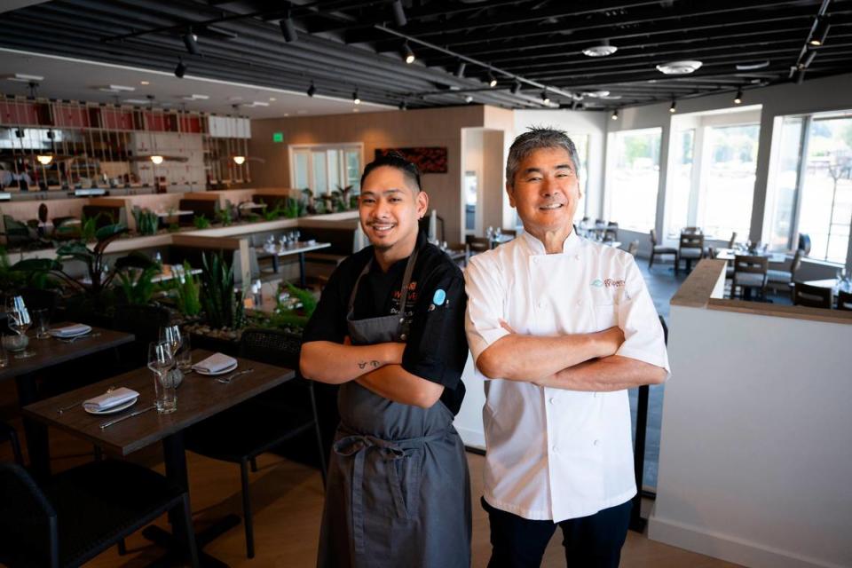 Executive chef Dexter Mina and chef-founder Roy Yamaguchi took a moment for a portrait before the grand opening of Woven Seafood & Chophouse on Tuesday.