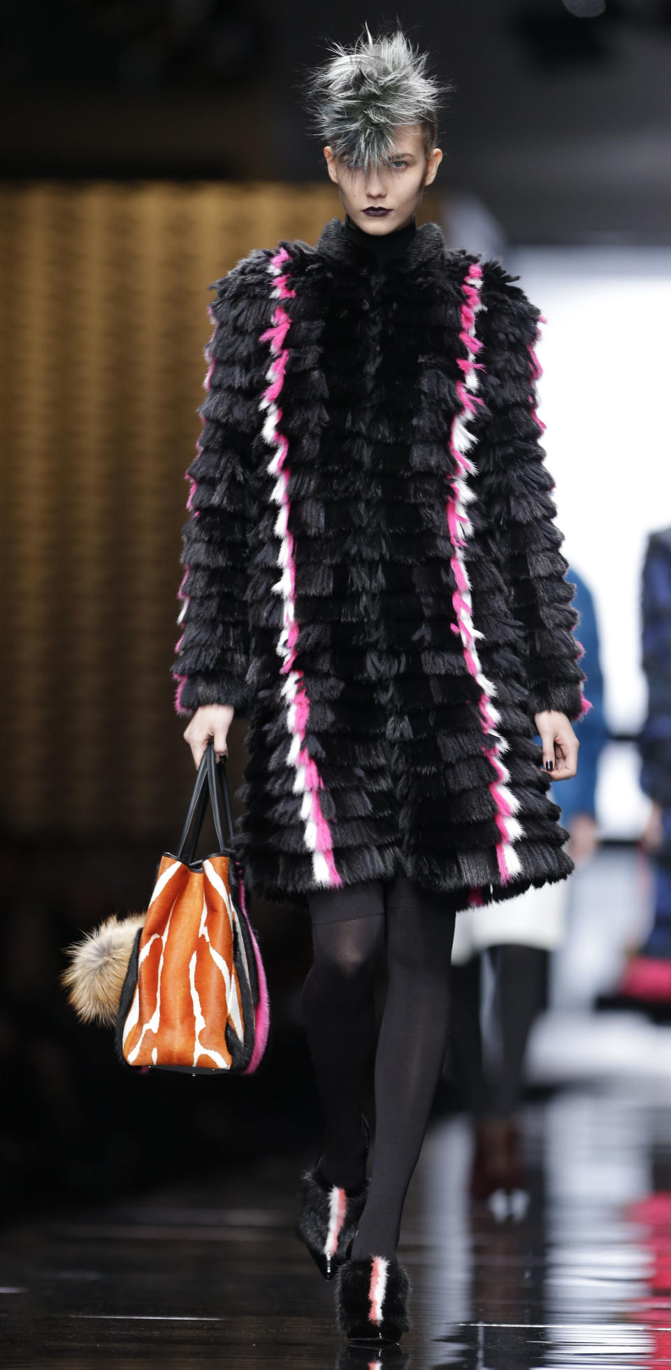 A model wears a creation for Fendi women's Fall-Winter 2013-14 collection, part of the Milan Fashion Week, unveiled in Milan, Italy, Thursday, Feb. 21, 2013. (AP Photo/Luca Bruno)