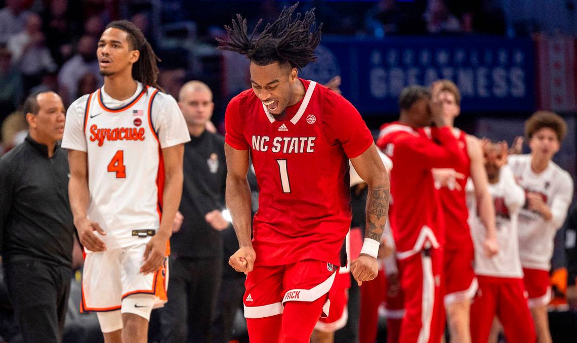 N.C. State’s Jayden Taylor (1) reacts after sinking a three-point basket to give the Wolfpack a 46-39 lead over Syracuse in the second half during the ACC Men’s Basketball Tournament at Capitol One Arena on Wednesday, March 13, 2024 in Washington, D.C. Taylor scored 18 points in the Wolfpack’s 83-65 victory. Robert Willett/rwillett@newsobserver.com