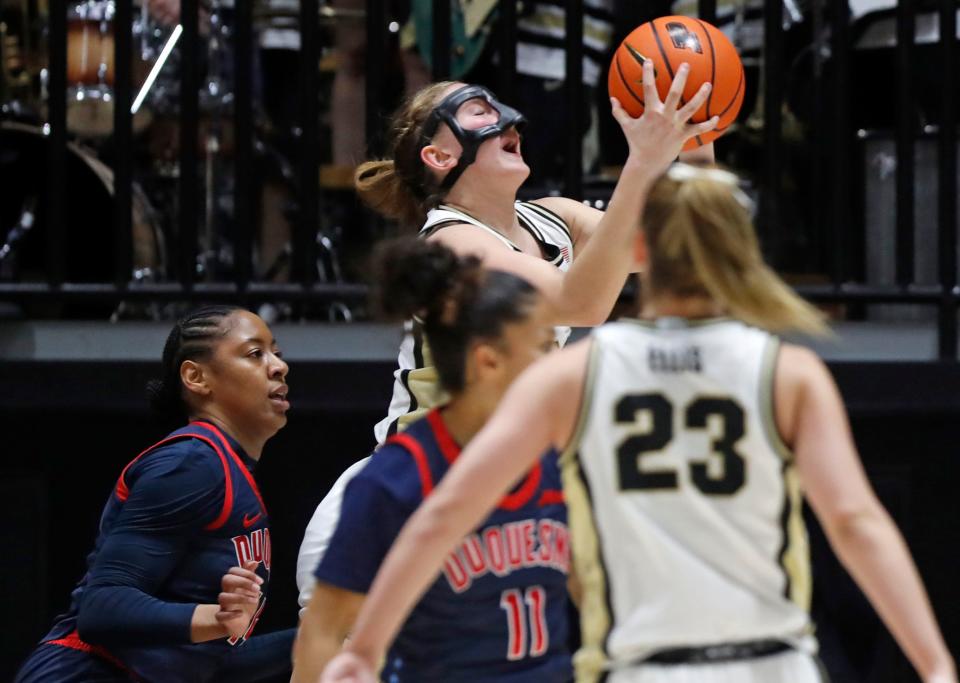 Purdue Boilermakers guard Abbey Ellis (23) passes to Purdue Boilermakers forward Mary Ashley Stevenson (20) during the NCAA WNIT basketball game against the Duquesne Dukes, Thursday, March 28, 2024, at Mackey Arena in West Lafayette, Ind.