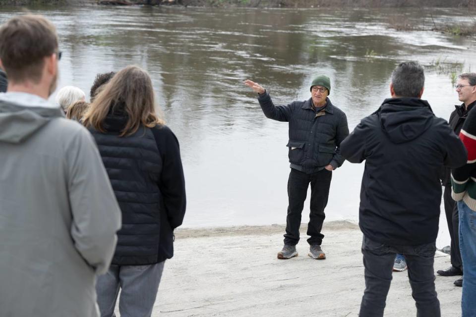 State Parks Director Armando Quintero talks with a group of local and state officials during a tour of the new boat ramp at Tuolumne River Regional Park in Modesto, Calif., Wednesday, Feb. 7, 2024.