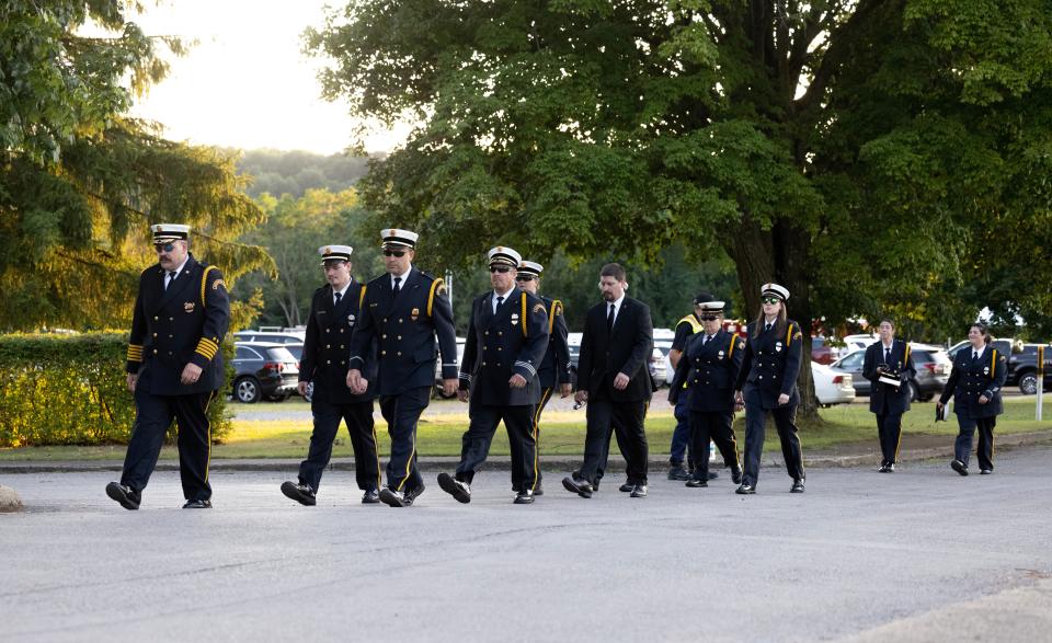 Members of the Saxonburg Burrough Fire Department depart from the calling hours of Corey Comperatore held at Laube Hall in Freeport Park in Freeport Pennsylvania. Comperatore died shielding his family from a would-be assassin's bullets that were aimed at former President Donald Trump during a rally Saturday.