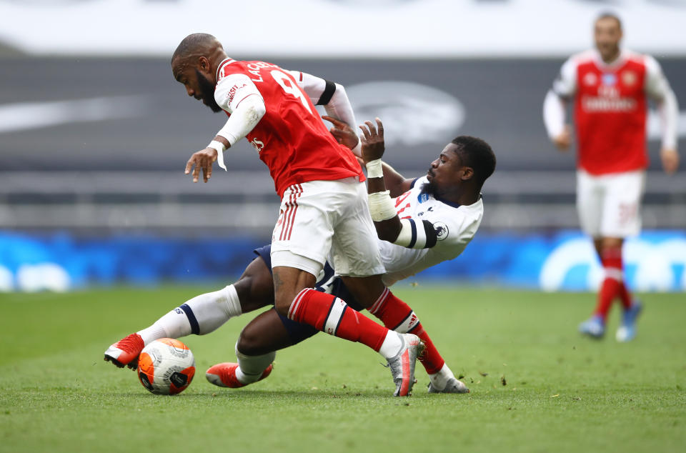 Tottenham Hotspur's Serge Aurier (right) in action with Arsenal's Alexandre Lacazette.