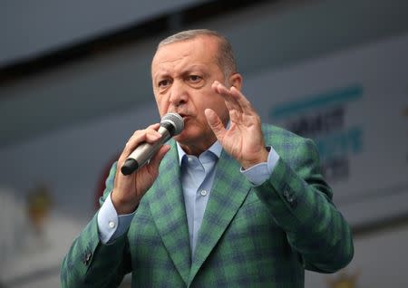 Turkish President Tayyip Erdogan addresses his supporters during an election rally in Istanbul, Turkey June 23, 2018. REUTERS/Umit Bektas