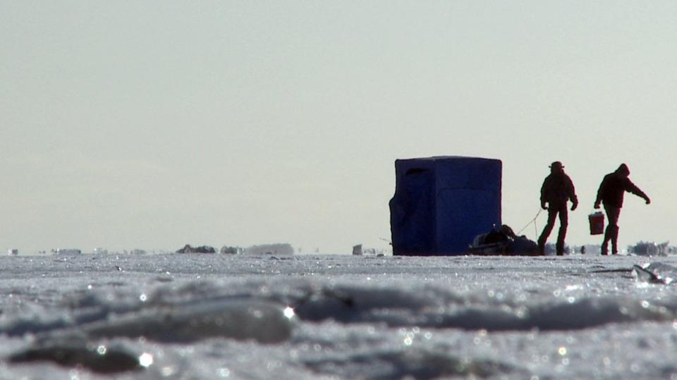 Ice fishers leave their shelter on Lake St. Clair in Harrison Twp. in 2010 — when there was plenty of ice cover to be on the lake safely.