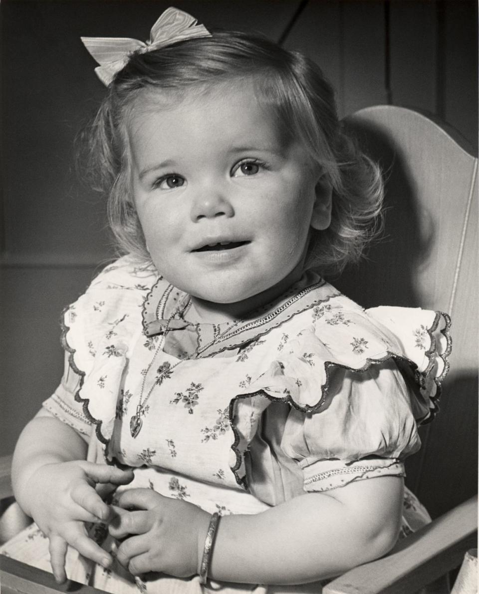 toddler sitting in her highchair