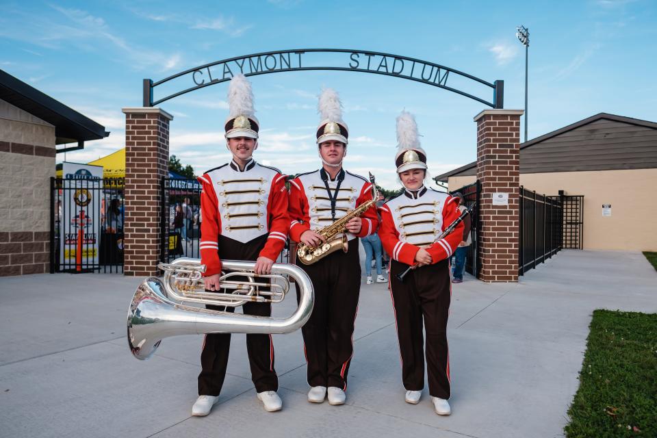 Claymont Marching Band members, Dawson Cox, from left, Alex Douglas, and Naomi Hallman will be traveling to New York City this year to play in the Macy's Thanksgiving Day Parade. They are shown outside Claymont Stadium.