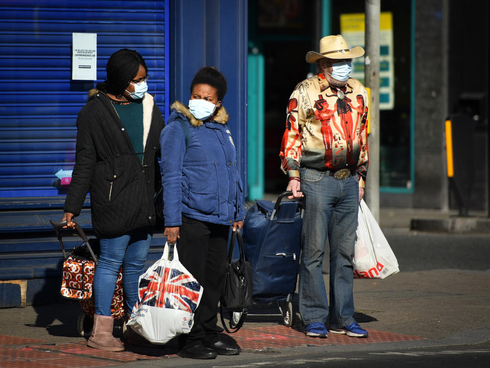 People wearing protective masks whilst shopping in South London as the UK continues in lockdown to help curb the spread of the coronavirus.