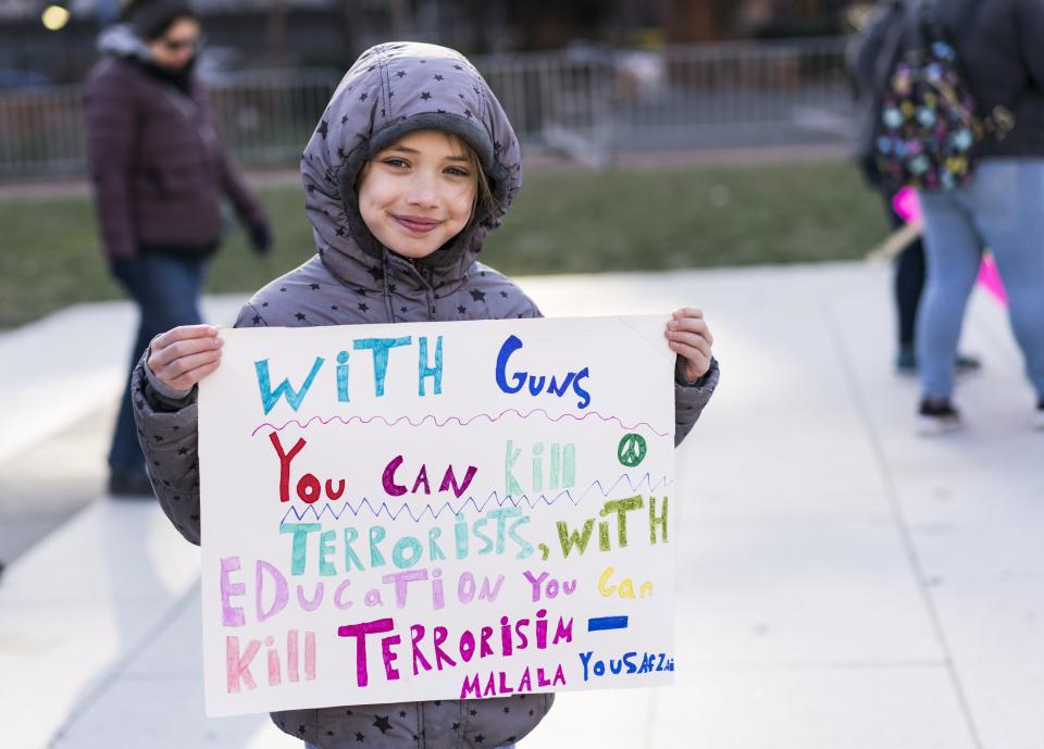 Emma Weill-Jones, 9, holds a sign featuring a quote from Malala Yousafzai at the March For Our Lives rally in Philadelphia.