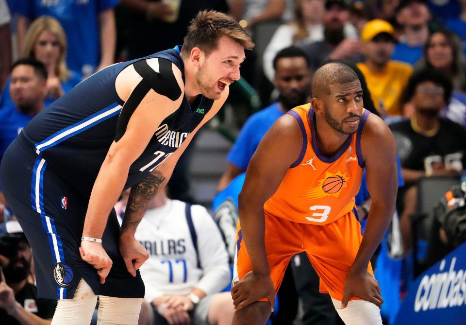 May 8, 2022; Dallas, Texas, USA;  Dallas Mavericks guard Luka Doncic (77) reacts after Phoenix Suns guard Chris Paul (3) fouled out of the game in the fourth quarter during game four of the second round for the 2022 NBA playoffs at American Airlines Center.