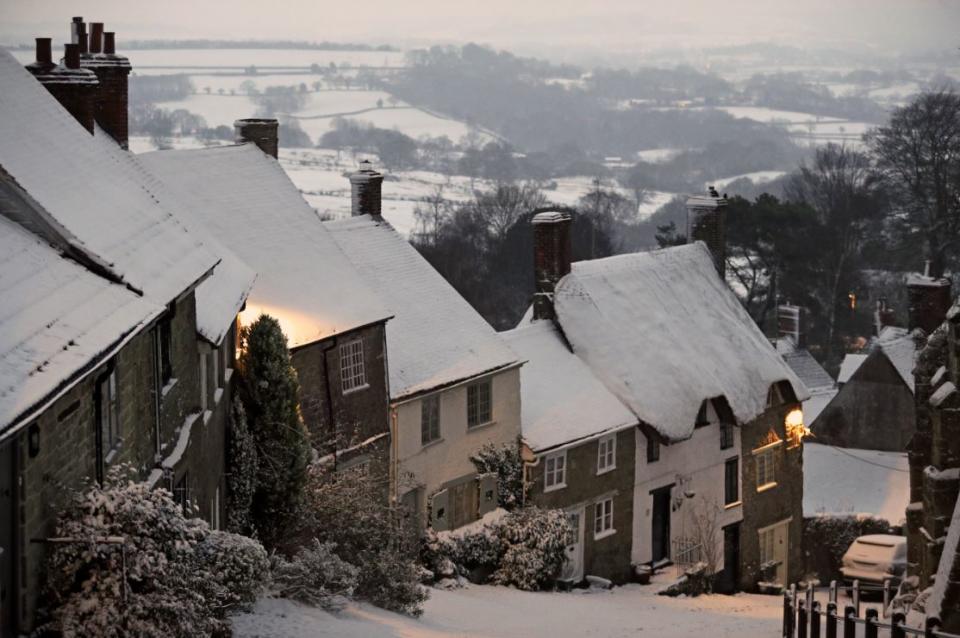Shaftesbury’s famous Gold HIll blanketed in snow (PA)