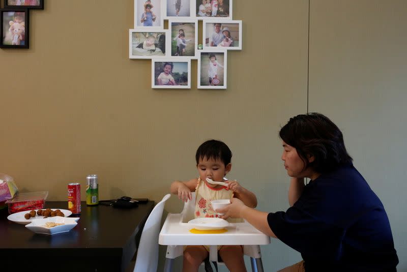 The Wider Image: Leaving Hong Kong: A family makes a wrenching decision