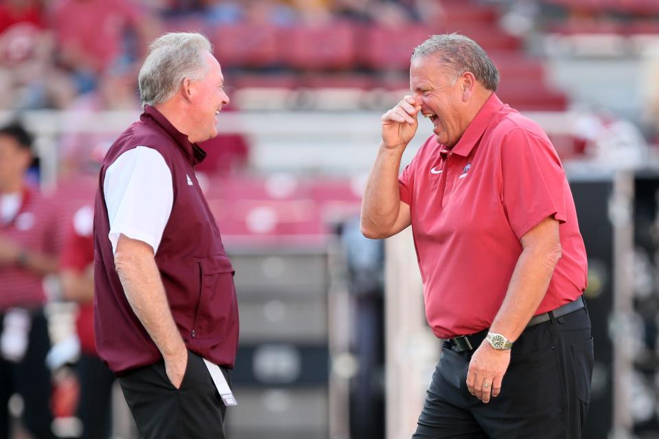 Sep 17, 2022; Fayetteville, Arkansas, USA; Missouri State Bears head coach Bobby Petrino talks to Arkansas Razorbacks head coach Sam Pittman prior to the game at Donald W. Reynolds Razorback Stadium. Mandatory Credit: Nelson Chenault-USA TODAY Sports