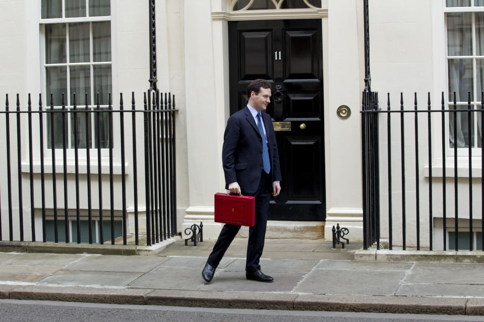 Britain's Chancellor of the Exchequer George Osborne turns to walk away after posing for the media with his traditional red dispatch box outside his official residence at No 11 Downing Street in London, as he departs to deliver his annual budget speech to the House of Commons, Wednesday, March 21, 2012. Britain's finance minister was expected to announce tax breaks for both the top and the bottom of the nation's income scale Wednesday in his annual budget, but his room for maneuver was limited by the government's drive to slash borrowing and protect its AAA credit rating. (AP Photo/Matt Dunham)