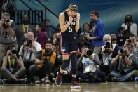 UConn's Paige Bueckers reacts after a college basketball game against Stanford in the semifinal round of the Women's Final Four NCAA tournament Friday, April 1, 2022, in Minneapolis. UConn won 63-58 to advance to the finals. (AP Photo/Eric Gay)