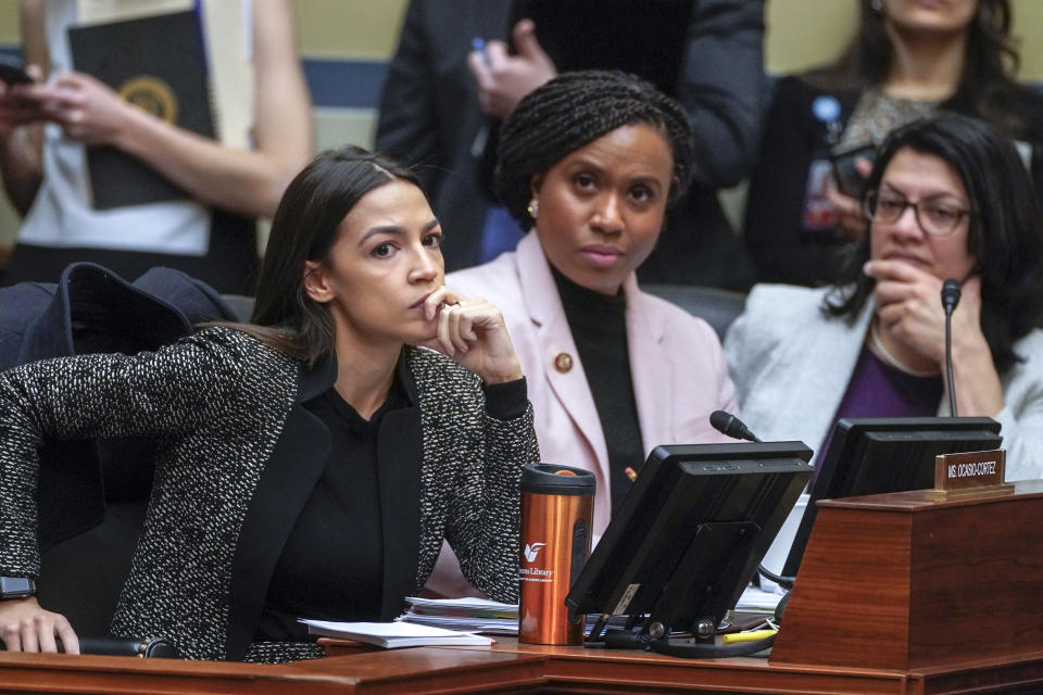 Rep. Alexandria Ocasio-Cortez, D-N.Y., Rep. Ayanna Pressley, D-Mass., and Rep. Rashida Tlaib, D-Mich., listen during a House Oversight and Reform Committee meeting in February. (AP Photo/J. Scott Applewhite)