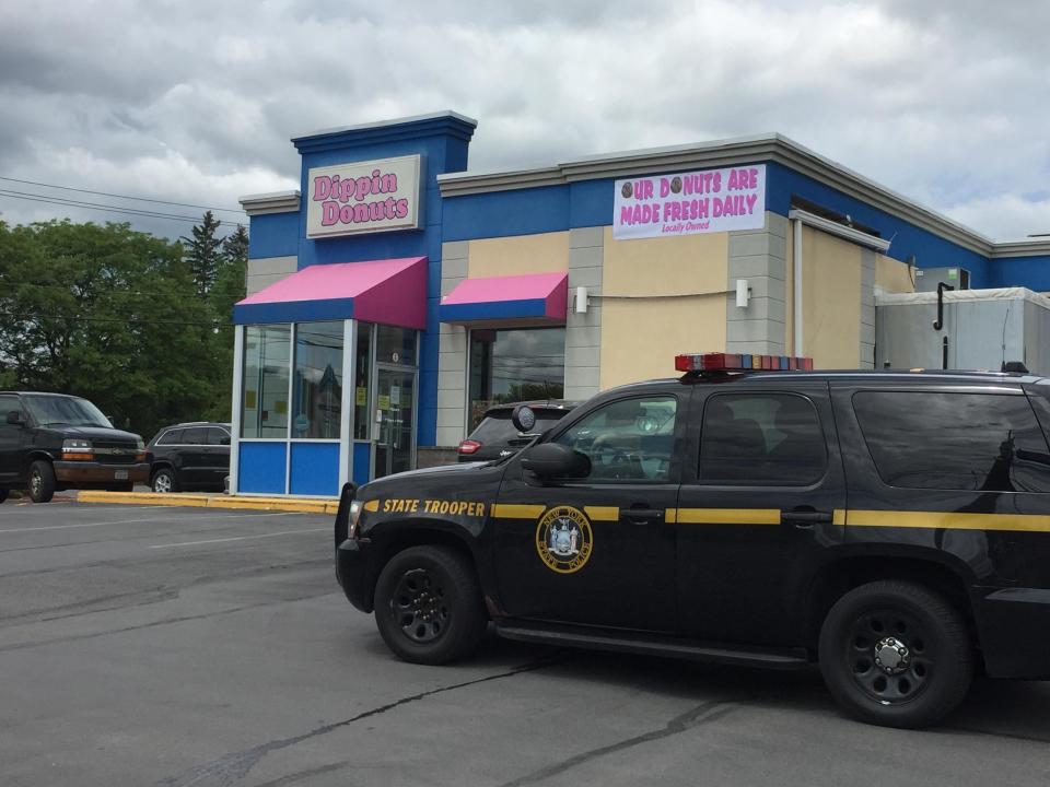 A state police vehicle at the Dippin Donuts store in New Hartford in June 2018. Officials at the time said their presence was IRS-related.