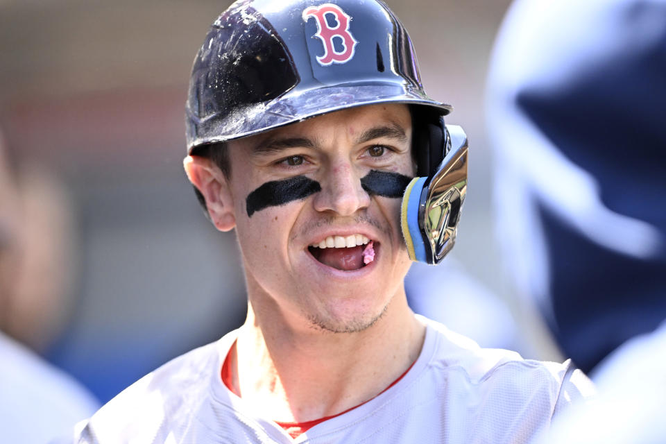 Boston Red Sox's Tyler O'Neill reacts in the dugout after hitting a solo home run during the third inning of a baseball game against the Los Angeles Angels in Anaheim, Calif., Sunday, April 7, 2024. (AP Photo/Alex Gallardo)