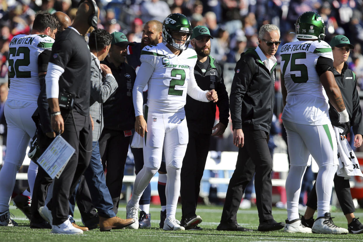 New York Jets quarterback Zach Wilson (2) walks off the field after an injury during the first half of an NFL football game against the New England Patriots, Sunday, Oct. 24, 2021, in Foxborough, Mass. (AP Photo/Stew Milne)