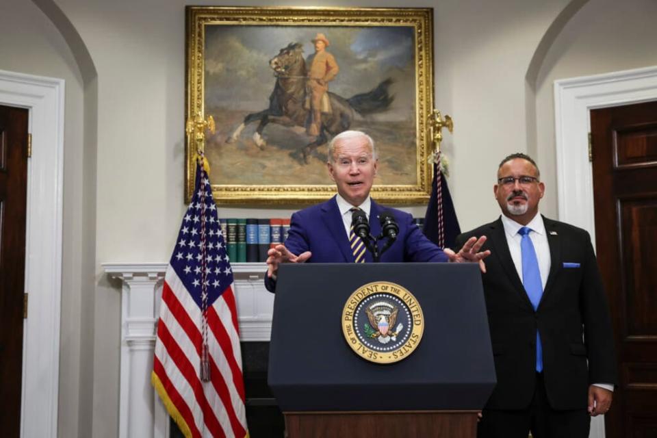 President Joe Biden, joined by Education Secretary Miguel Cardona, discussed his student debt relief plan at the White House this week. (Photo by Alex Wong/Getty Images)