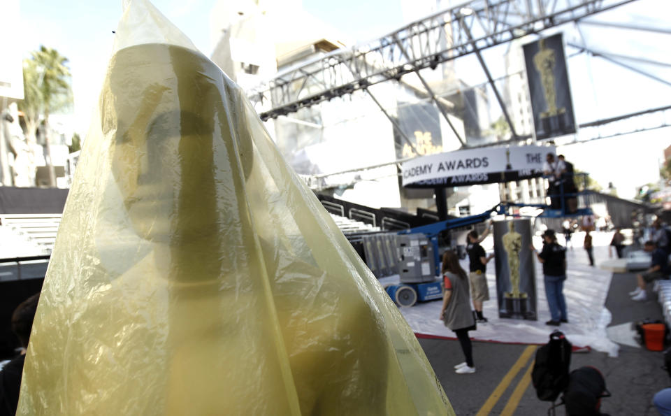 An Oscar statuette is seen the red carpet before the 84th Academy Awards in Los Angeles, Wednesday, Feb. 22, 2012. The Academy Awards will be held Sunday, Feb. 26, 2012. (AP Photo/Matt Sayles)