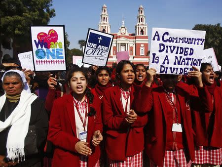 Demonstrators shout slogans as they hold placards during a protest outside a church in New Delhi February 5, 2015. REUTERS/Anindito Mukherjee