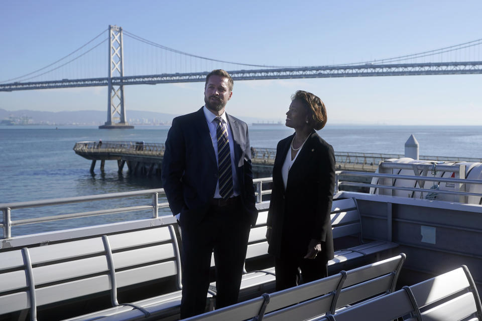 Nuria Fernandez, Federal Transit Administration administrator, right, speaks with Seamus Murphy, Executive Director of San Francisco Bay Ferry, while touring a San Francisco Bay Ferry in San Francisco, Thursday, Nov. 30, 2023. (AP Photo/Jeff Chiu)