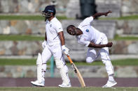 West Indies' Kemar Roach bowls against India during day one of the first Test cricket match at the Sir Vivian Richards cricket ground in North Sound, Antigua and Barbuda, Thursday, Aug. 22, 2019. (AP Photo/Ricardo Mazalan)