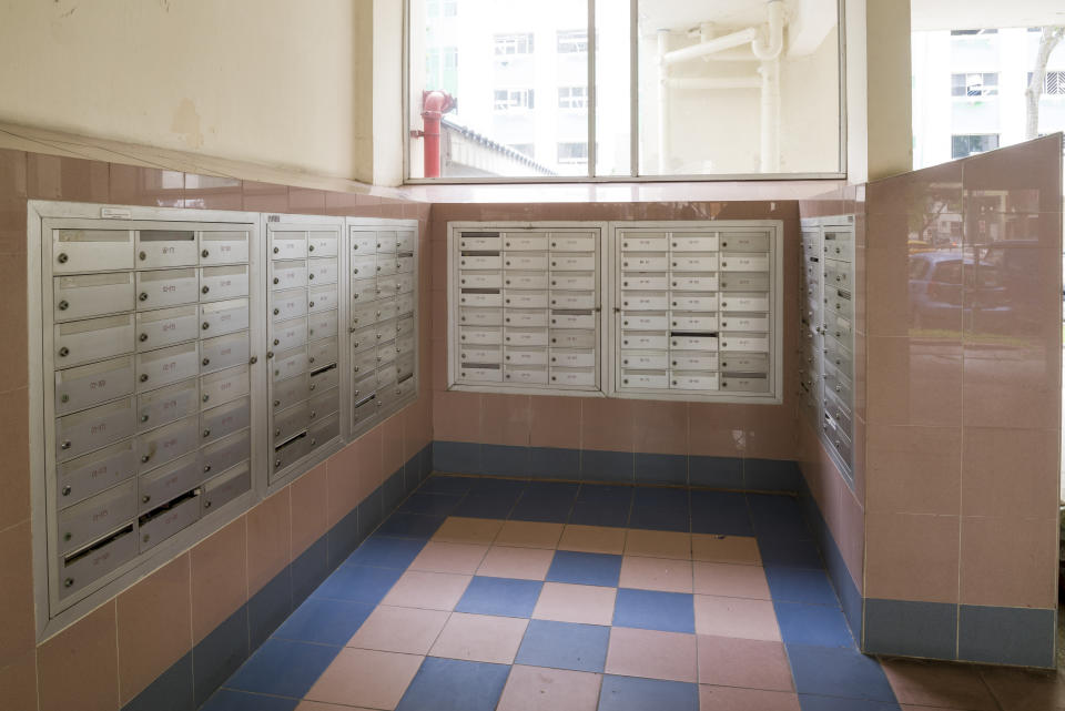 Singapore, Singapore - May 26, 2013: Letter box area of public housing flats at Tampines New Town. Residents receive letters and numinous advertising flyers from their letter box.