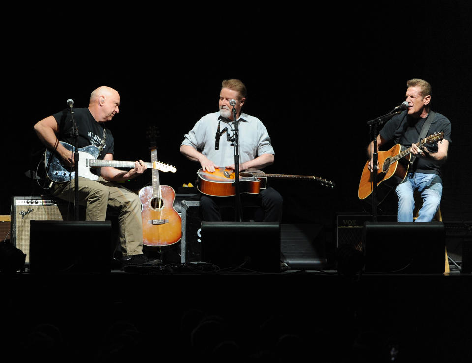 Musicians Bernie Leadon, left, Don Henley and Glenn Frey, right, of the Eagles perform at Madison Square Garden on Friday, Nov. 8, 2013 in New York. (Photo by Evan Agostini/Invision/AP)