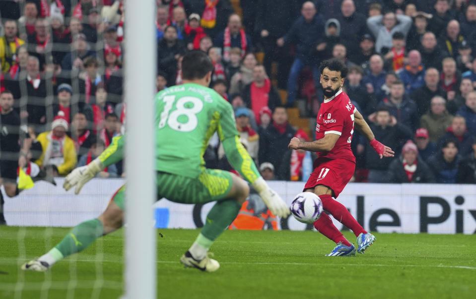 Liverpool's Mohamed Salah makes an attempt to score during the English Premier League soccer match between Liverpool and Manchester City, at Anfield stadium in Liverpool, England, Sunday, March 10, 2024. (AP Photo/Jon Super)