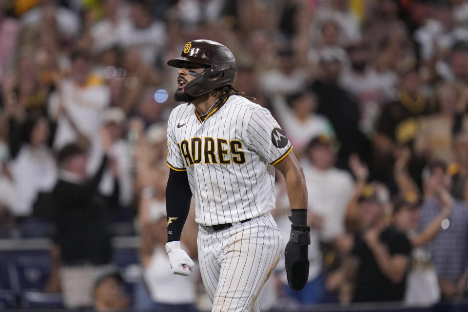 San Diego Padres' Fernando Tatis Jr. celebrates after stealing home during the seventh inning of a baseball game against the Baltimore Orioles, Wednesday, Aug. 16, 2023, in San Diego. (AP Photo/Gregory Bull)