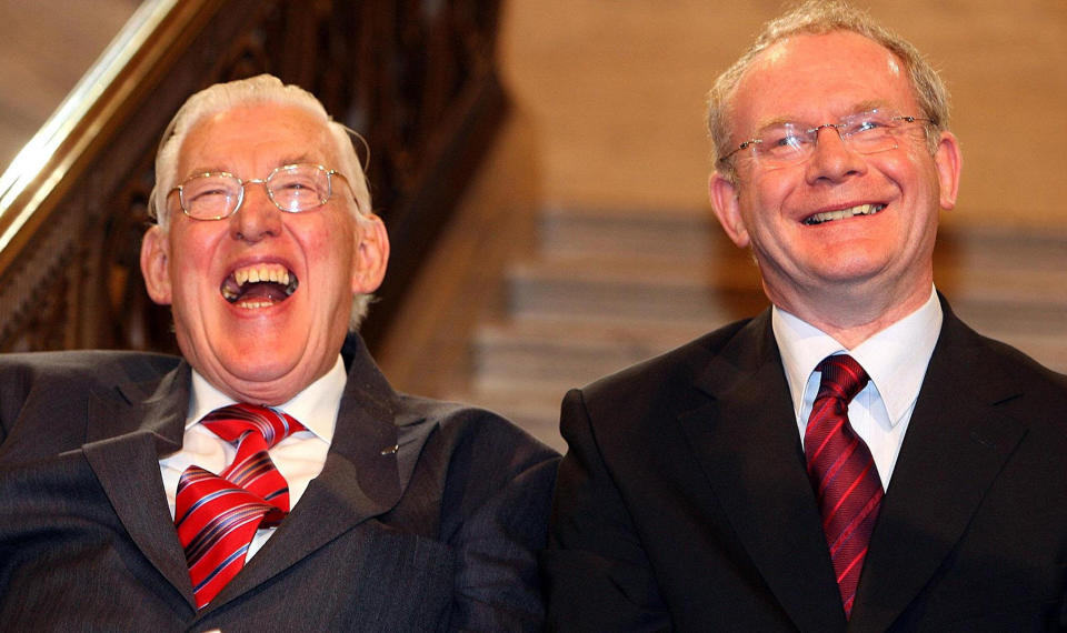 FILE - In this Tuesday, May 8, 2007, file photo, Northern Ireland's First Minister Ian Paisley and Deputy First Minister Martin McGuinness smile after being sworn in as ministers of the Northern Ireland Assembly, at the Stormont Parliamentary Building, Belfast. Relations between Britain and Ireland have experienced many highs and lows in a century marked by rebellion, terror and treaties. The deadlock was broken in 2007, when Sinn Fein voted to accept the authority of Northern Ireland’s police force. Paisley then stunned Northern Ireland by agreeing to form a coalition alongside McGuinness, the former IRA commander. The Democratic Unionist-Sinn Fein coalition since has governed the country with few rows and surprising stability. (AP Photo/Paul Faith, Pool, File)